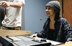 AN 澳门赌场 Audio Technology Program student works on one of the program's high-tech soundboards like the Raven console